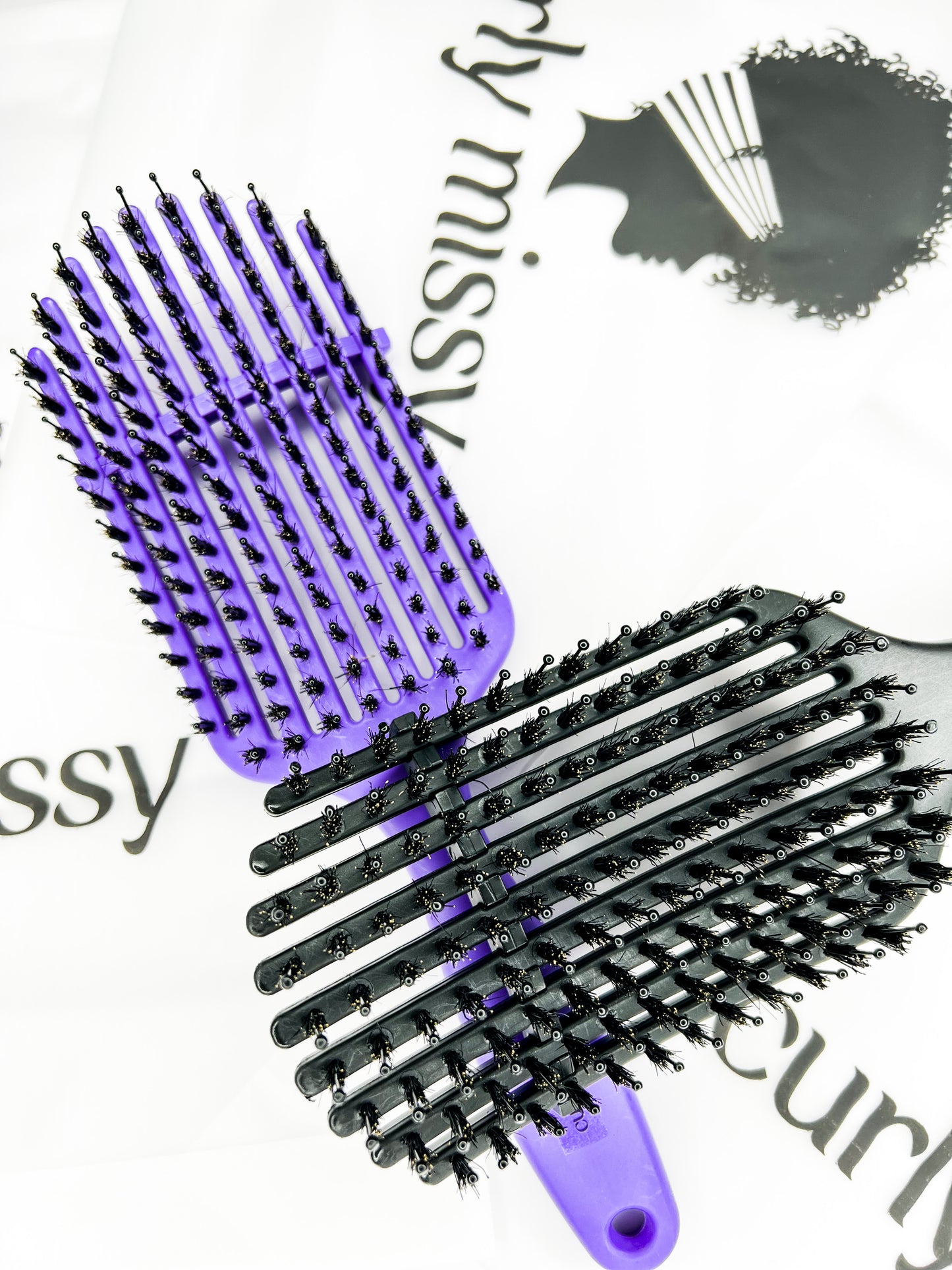 The Curved 9 Finger Boar Bristle Brush